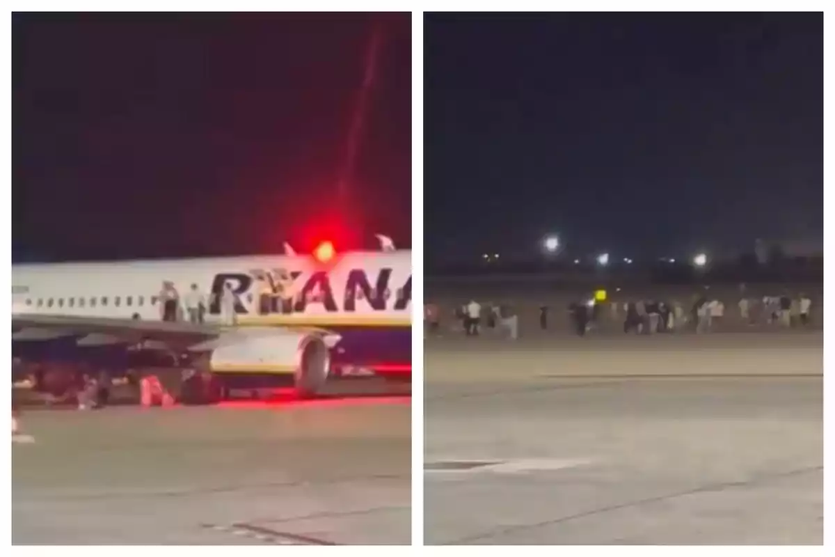 Un avión de Ryanair detenido en la pista durante la noche con pasajeros y tripulación fuera de la aeronave y grupos de personas reunidas a lo lejos en el aeropuerto.