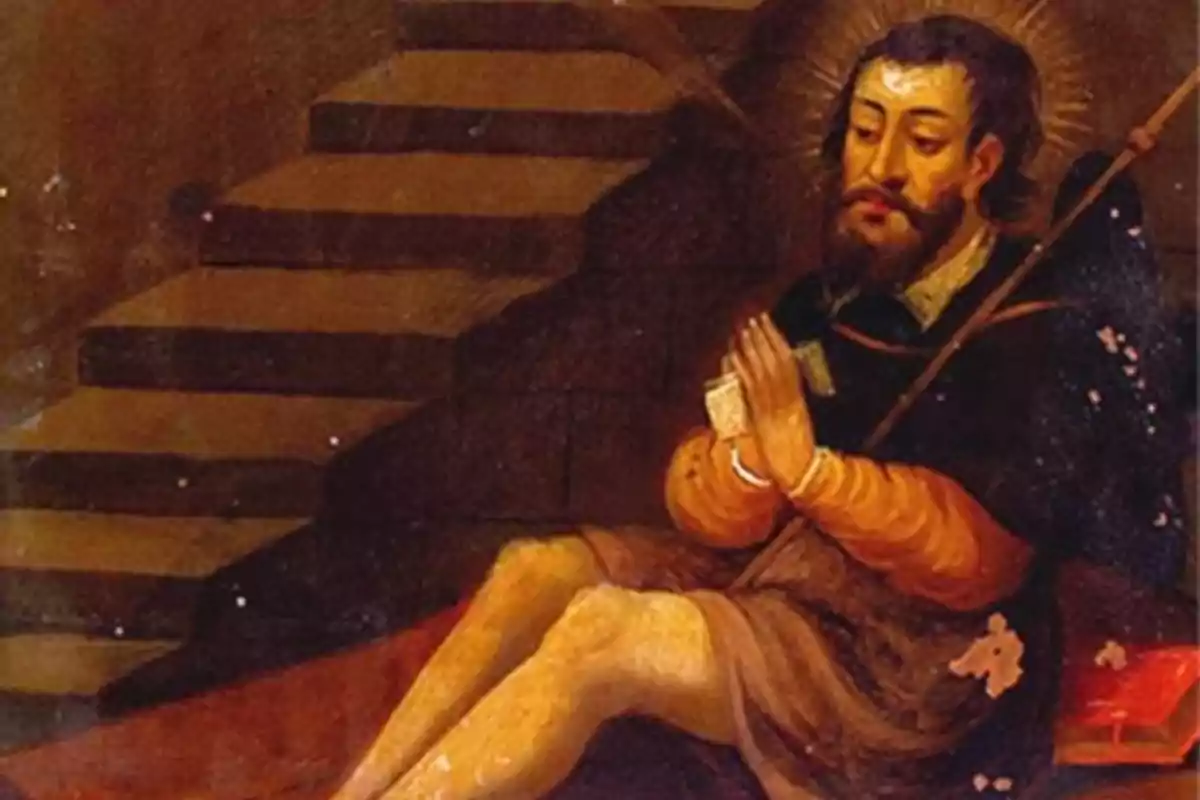 Hombre con barba y aureola sentado en el suelo con las manos juntas en actitud de oración frente a unas escaleras Hombre con barba y aureola sentado en el suelo con las manos juntas en actitud de oración frente a unas escaleras