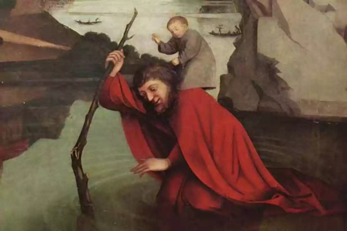 Un hombre con túnica roja cruza un río apoyado en un bastón mientras lleva a un niño sobre sus hombros