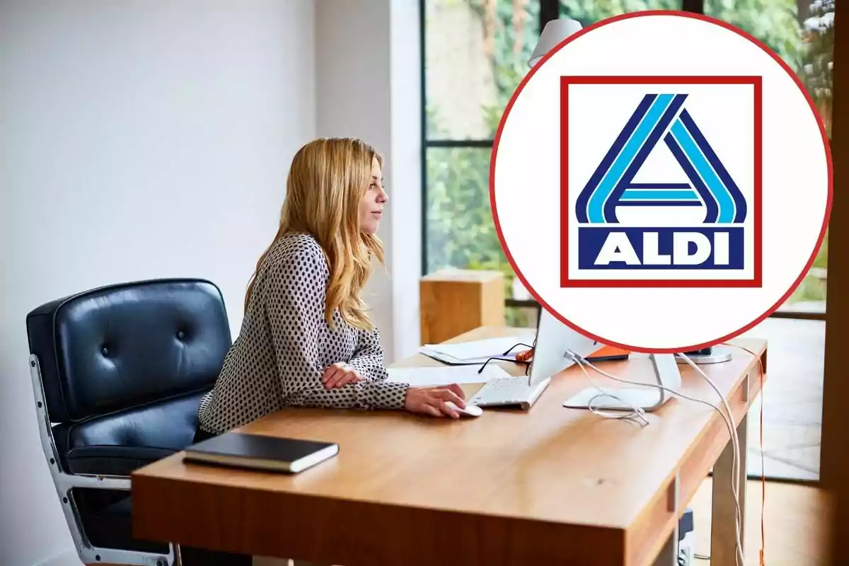 Mujer trabajando en una oficina con el logotipo de Aldi en primer plano.