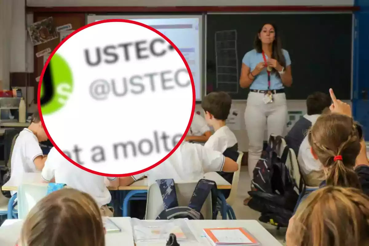 Una maestra está de pie frente a una clase de niños sentados en sus escritorios mientras uno de ellos levanta la mano y un círculo resalta un texto borroso en la esquina superior izquierda.