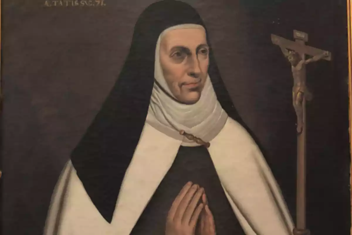 Pintura de una monja con hábito blanco y negro rezando junto a un crucifijo Pintura de una monja con hábito blanco y negro rezando junto a un crucifijo