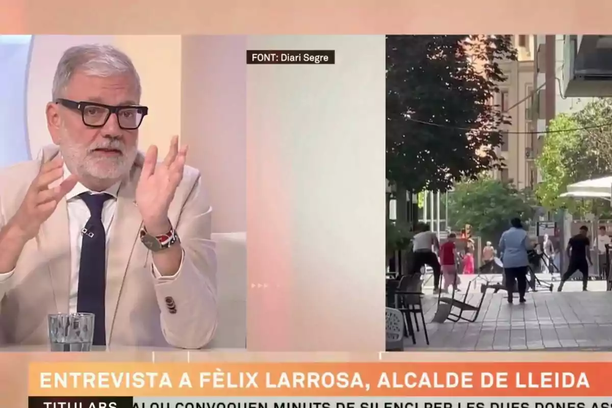 Entrevista a un hombre con gafas y barba blanca, identificado como alcalde de Lleida, junto a una imagen de una calle con varias personas caminando.