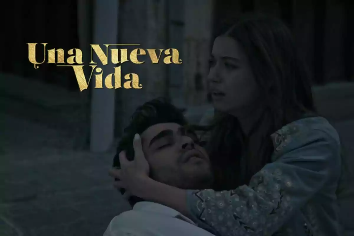 Seyran sostiene a Ferit en sus brazos mientras ambos están sentados en el suelo, con el título "Una Nueva Vida" en letras doradas sobre un fondo oscuro.