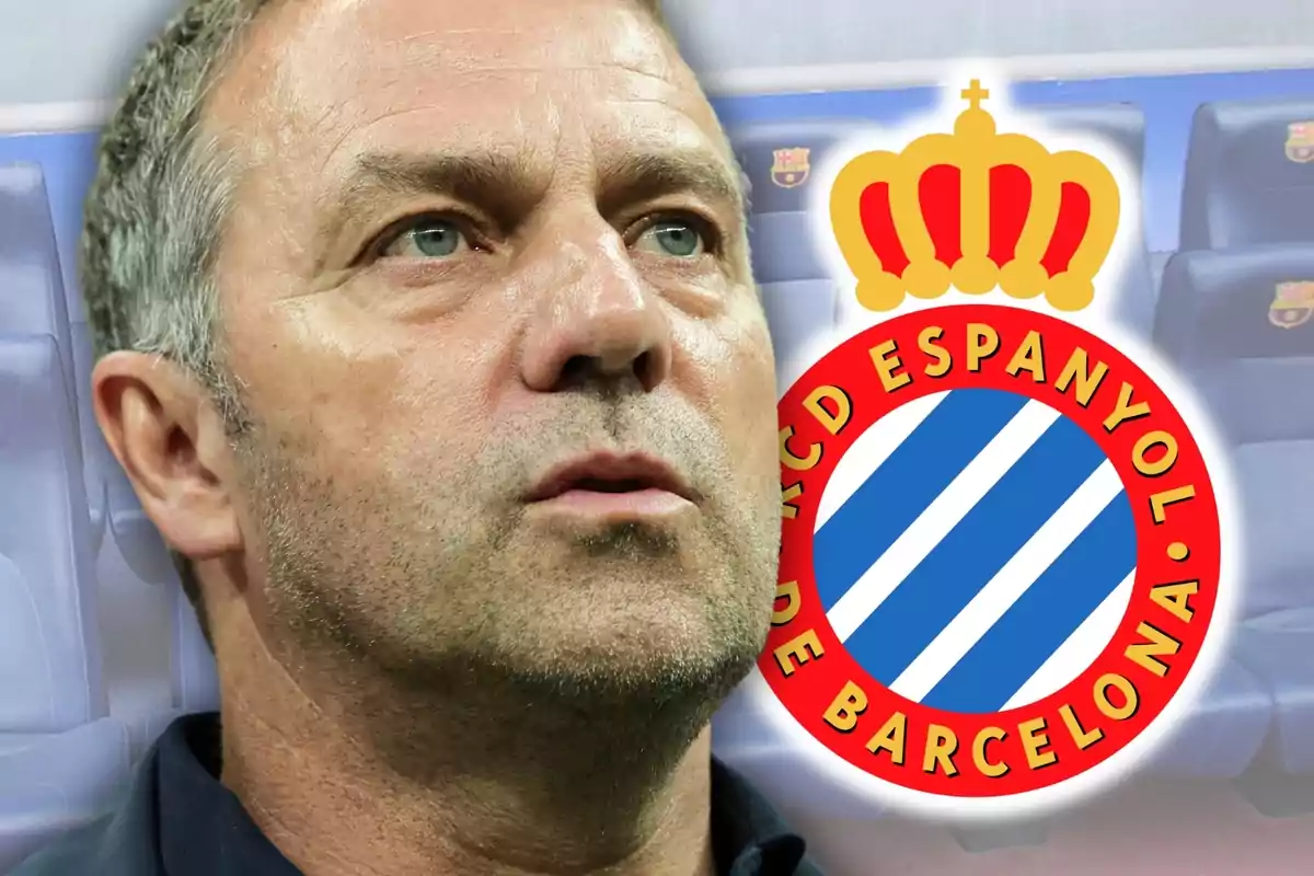 Un hombre con expresión seria junto al escudo del RCD Espanyol de Barcelona.