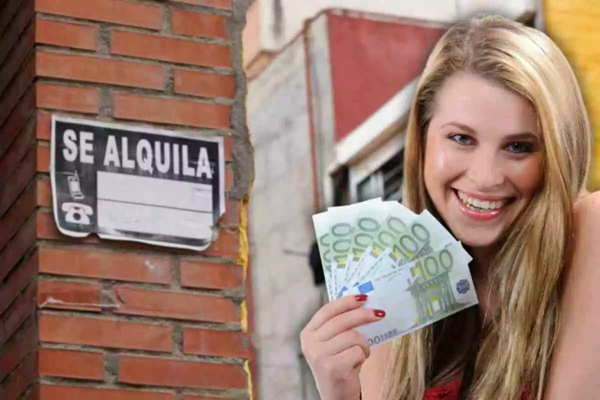 Una mujer sonriente sostiene billetes de 100 euros junto a un cartel de "Se Alquila" en una pared de ladrillos.