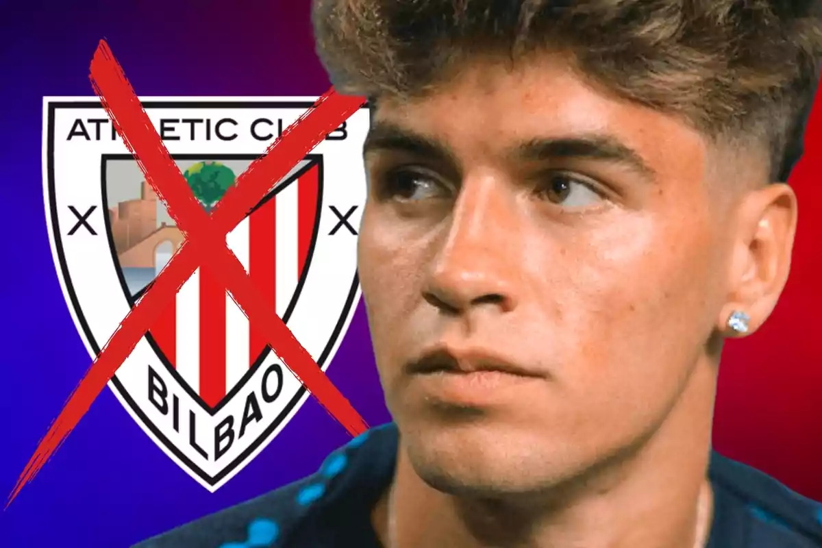 Un hombre joven con expresión seria aparece frente a un escudo del Athletic Club de Bilbao que tiene una gran cruz roja sobre él.