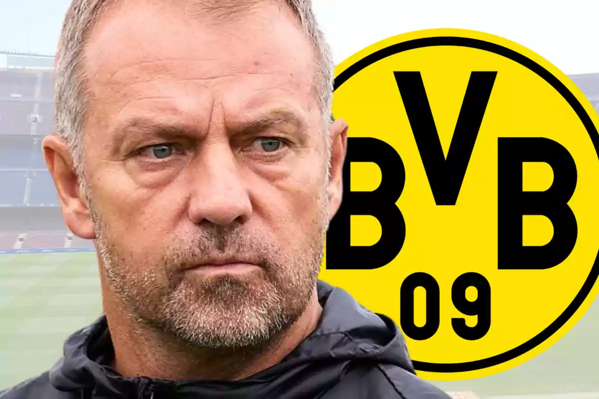 Un hombre con expresión seria frente al logo del Borussia Dortmund.