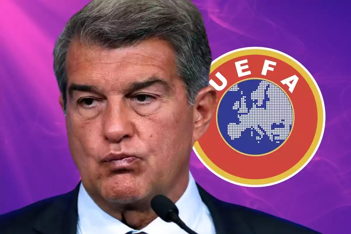 Un hombre con expresión seria frente a un logotipo de la UEFA sobre un fondo púrpura.