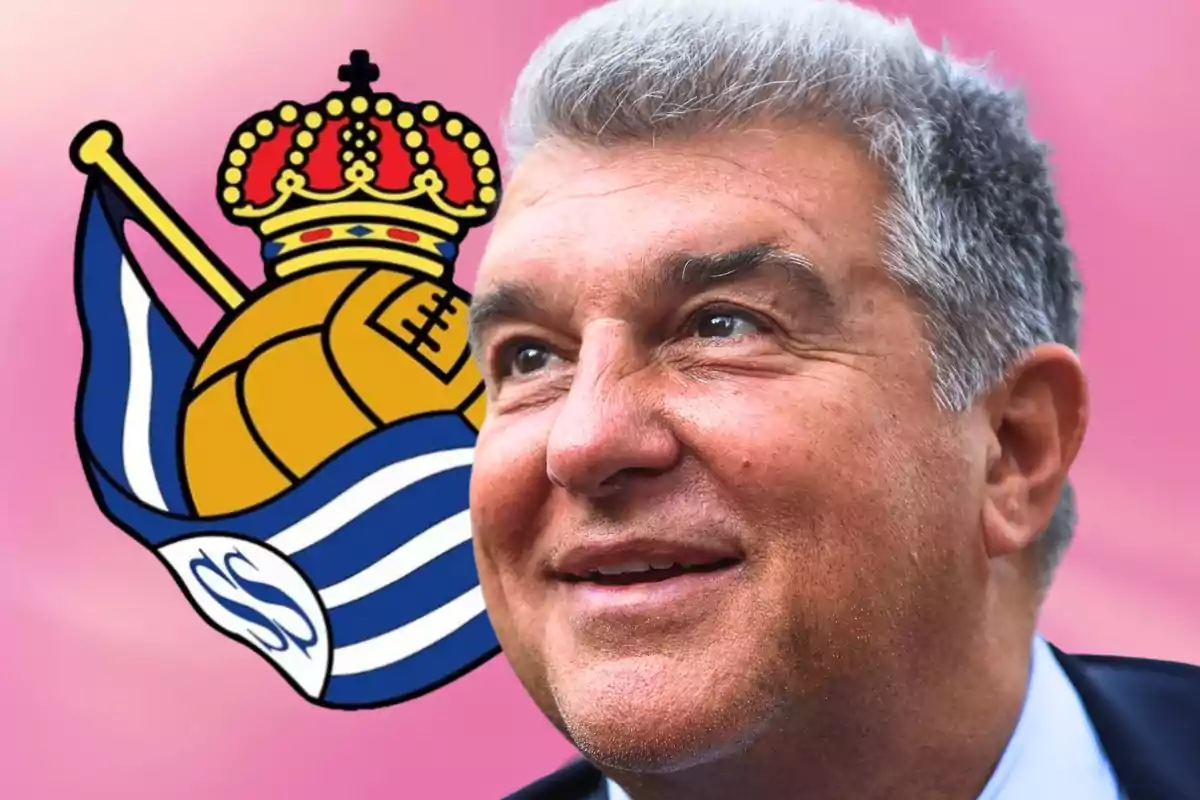 Un hombre sonriente con cabello canoso y fondo rosa, junto al escudo de la Real Sociedad.