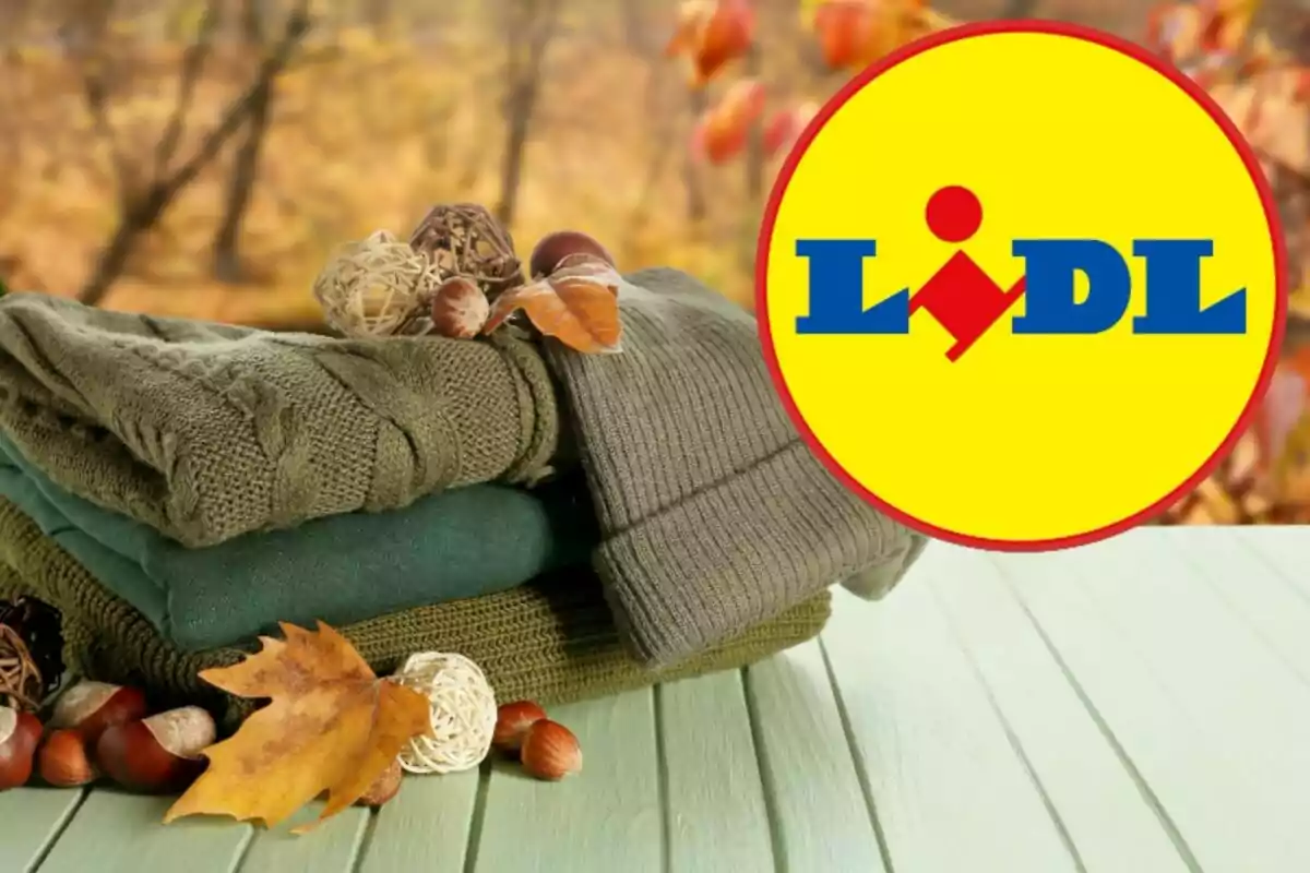 Ropa de otoño en tonos verdes con hojas y frutos secos sobre una mesa de madera con el logo de Lidl en la esquina.