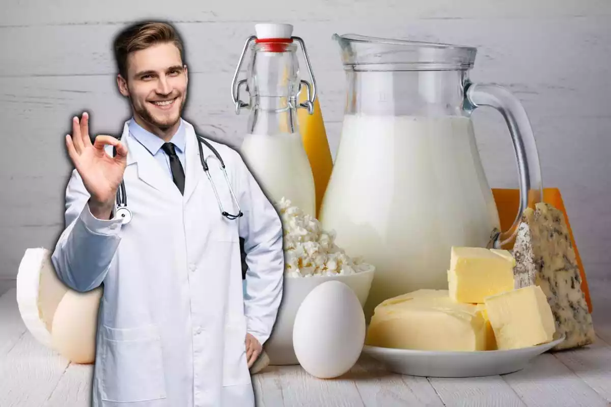 Médico con gesto de 'okey' y productos lácteos detrás
