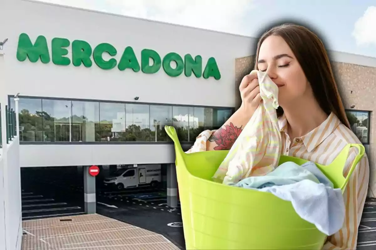 Una mujer sostiene una cesta verde con ropa limpia mientras huele una prenda, con un supermercado Mercadona de fondo.