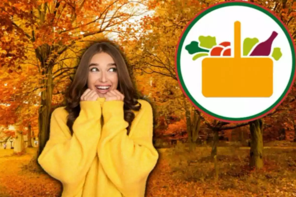 Mujer sonriente con suéter amarillo en un bosque otoñal con hojas naranjas y un logotipo de cesta de alimentos.