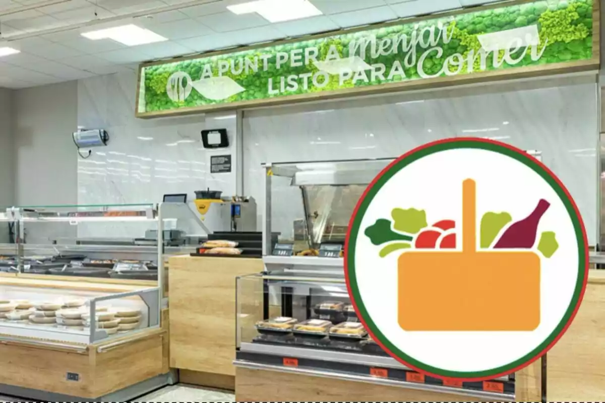 Mostrador de comida preparada en un supermercado con un cartel que dice "A PUNT PER A MENJAR LISTO PARA COMER" y un icono de una cesta con alimentos.