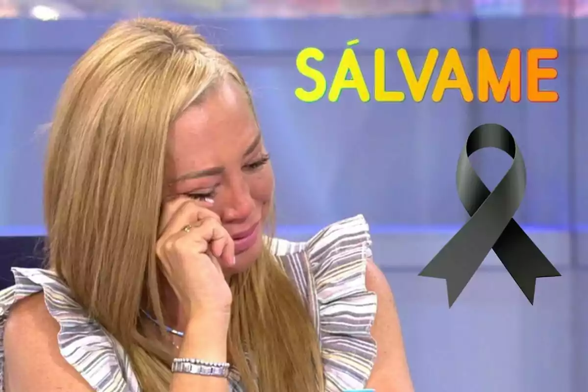 Belén Esteban llorando con la mano en la cara, con el texto "SÁLVAME" en colores brillantes y un lazo negro en la esquina derecha.