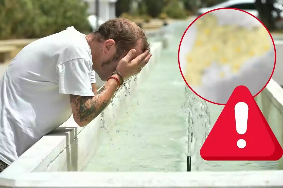 Un hombre se lava la cara en una fuente de agua al aire libre, con un símbolo de advertencia en la esquina inferior derecha.