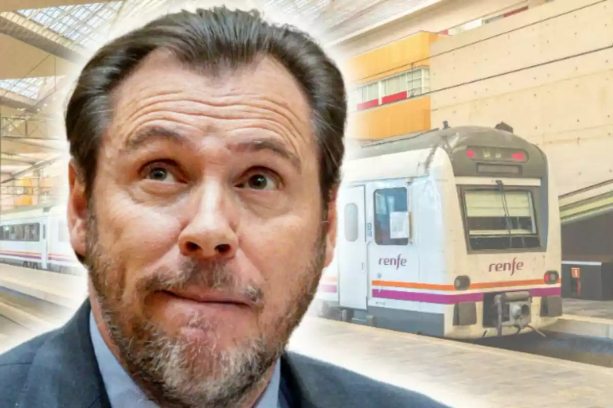 Montaje de fotos de Óscar Puente con expresión pensativa aparece en primer plano mientras un tren de Renfe está estacionado en una estación de tren moderna al fondo. Montaje de fotos de Óscar Puente con expresión pensativa aparece en primer plano mientras un tren de Renfe está estacionado en una estación de tren moderna al fondo.