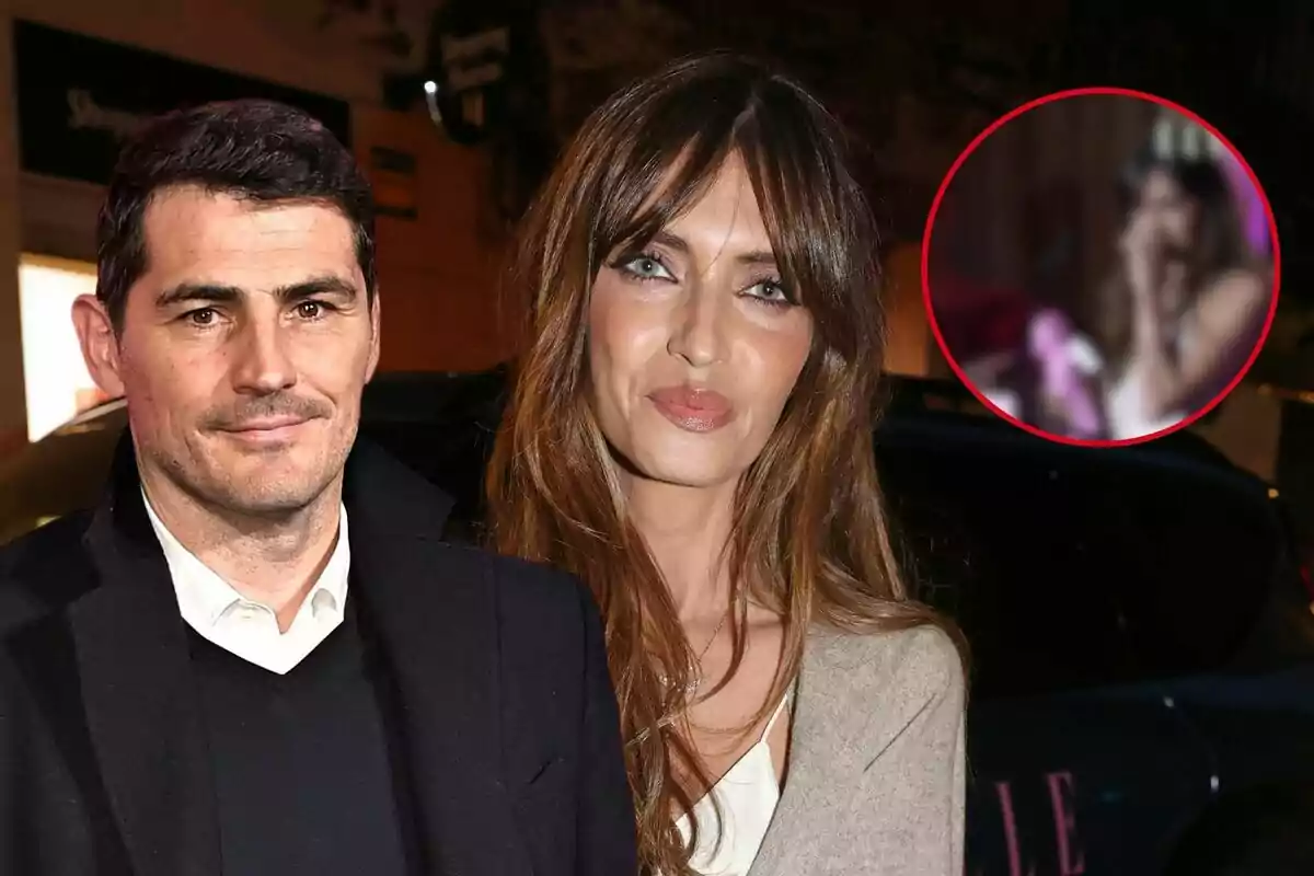 Iker Casillas y Sara Carbonero posando para una foto en un evento nocturno con un círculo en la esquina superior derecha que muestra una imagen borrosa de una persona.