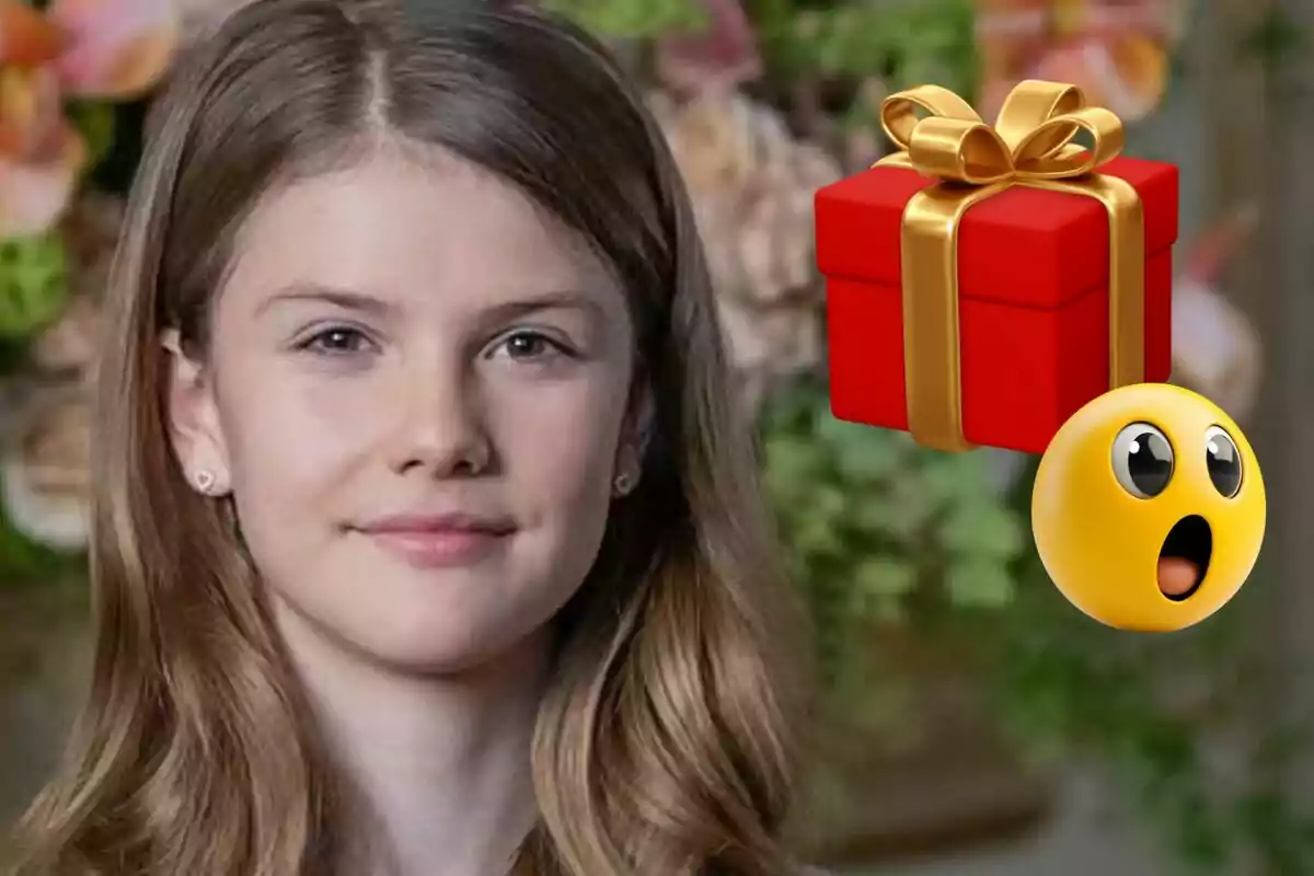 La princesa Estelle sonríe suavemente mientras un emoji sorprendido y un regalo rojo con lazo dorado flotan a su lado.
