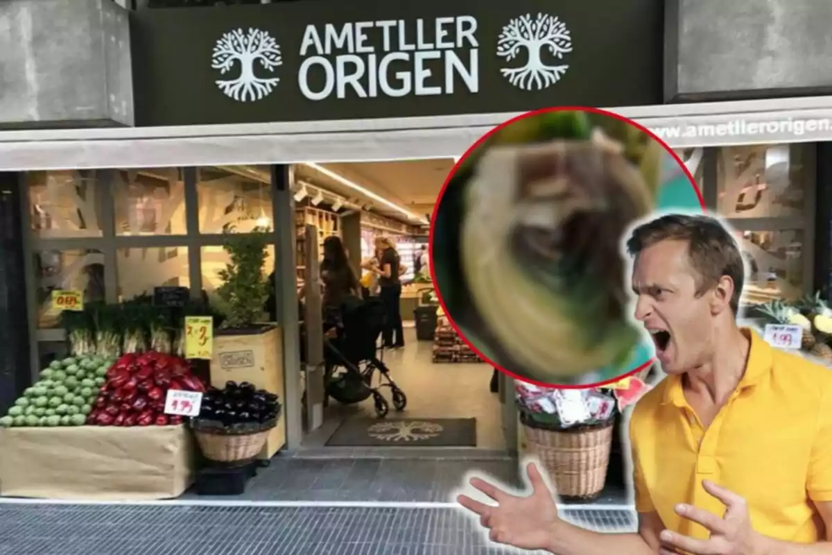 Un hombre con expresión de enojo frente a una tienda de Ametller Origen con frutas y verduras en la entrada.