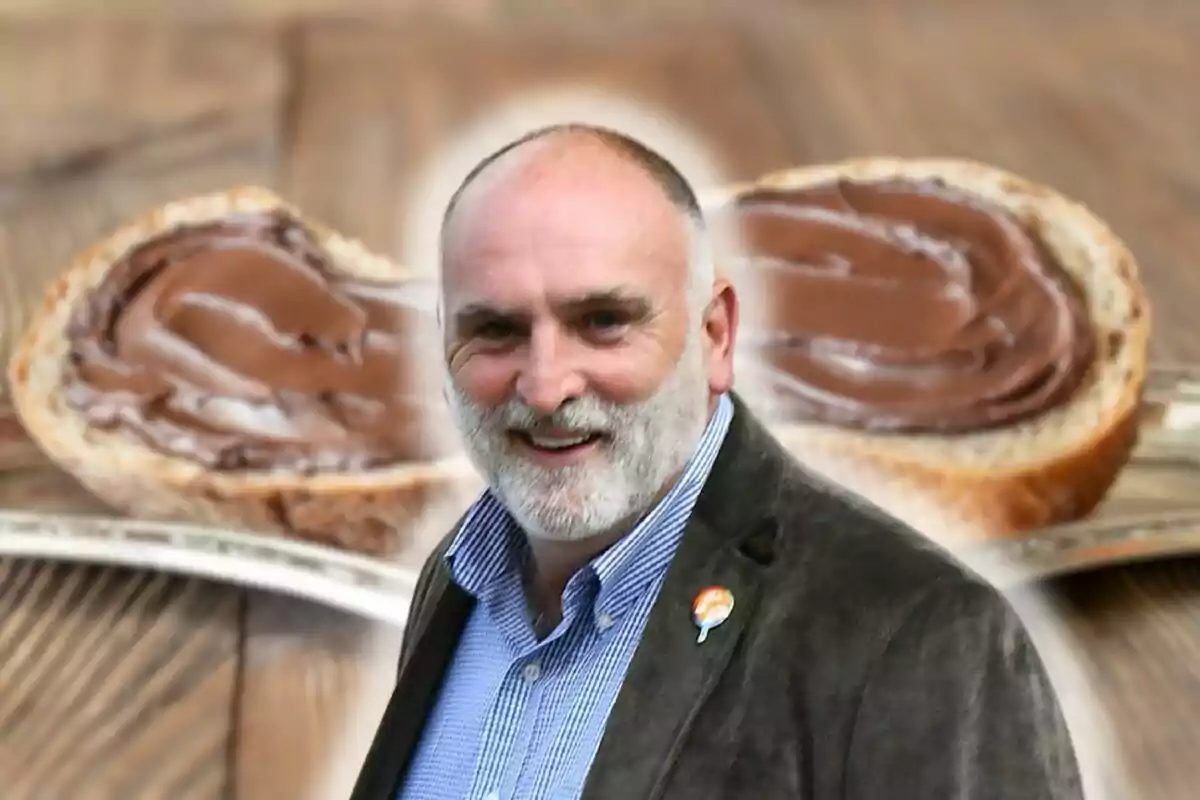 José Andrés sonriente con barba y chaqueta frente a un fondo de pan con crema de chocolate.