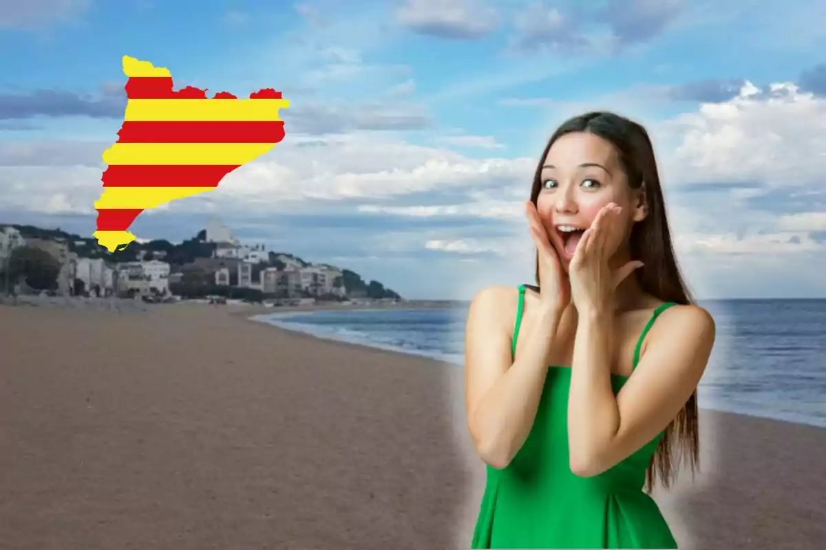 Una mujer sorprendida en la playa con la bandera de Cataluña en el cielo.