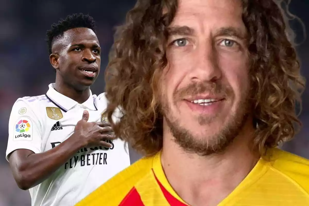 Carles Puyol en primer plano con Vinícius Júnior al fondo tocando el escudo del Real Madrid