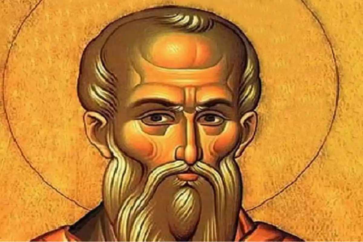 Icono religioso de un hombre con barba y aureola sobre fondo dorado