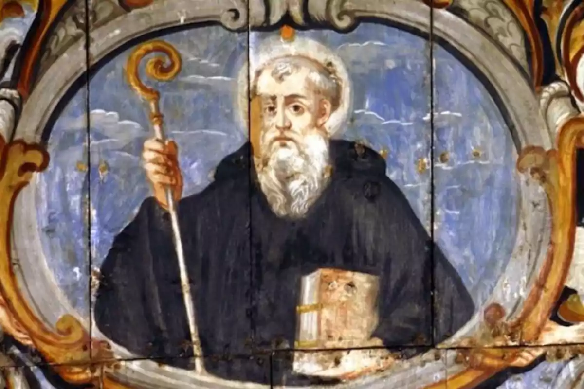 Pintura religiosa de un hombre con barba blanca vestido con túnica oscura sosteniendo un báculo en una mano y un libro en la otra rodeado de un marco decorativo Pintura religiosa de un hombre con barba blanca vestido con túnica oscura sosteniendo un báculo en una mano y un libro en la otra rodeado de un marco decorativo