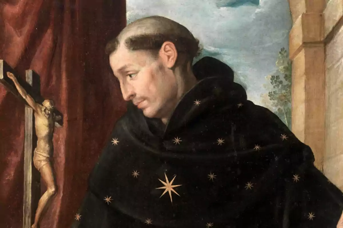 Pintura de un monje con hábito negro decorado con estrellas doradas, mirando hacia un crucifijo en el fondo.