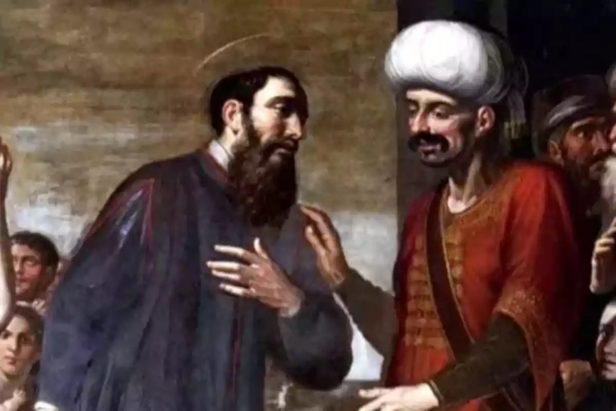 Pintura antigua que muestra a dos hombres conversando, uno con barba y túnica oscura y el otro con turbante blanco y vestimenta roja