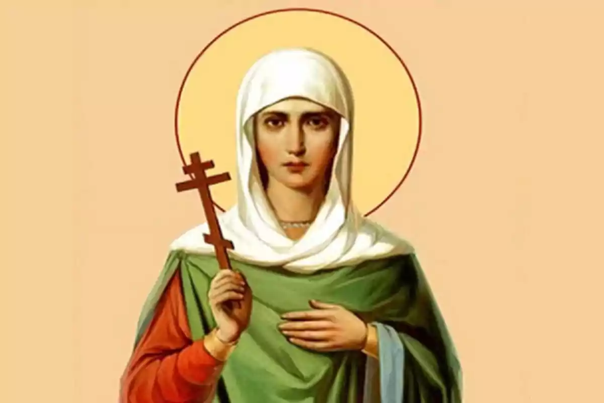 Una imagen de una figura religiosa con un halo dorado sosteniendo una cruz ortodoxa y vestida con túnica verde y manto blanco. Una imagen de una figura religiosa con un halo dorado sosteniendo una cruz ortodoxa y vestida con túnica verde y manto blanco.