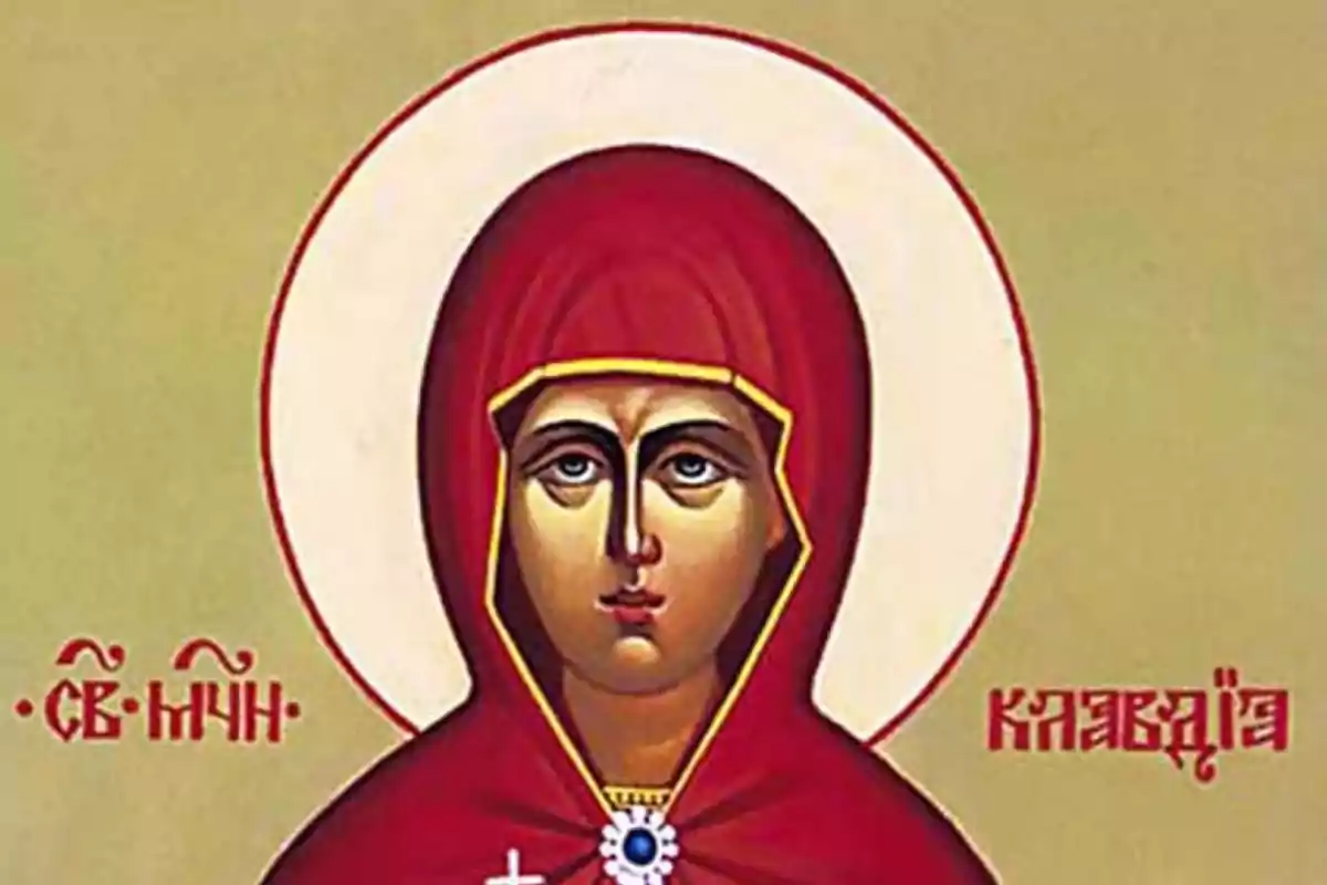 Una imagen de un icono religioso que muestra a una figura con un manto rojo y un halo blanco sobre un fondo beige con inscripciones en un idioma eslavo. Una imagen de un icono religioso que muestra a una figura con un manto rojo y un halo blanco sobre un fondo beige con inscripciones en un idioma eslavo.