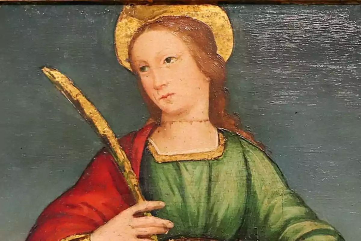 Pintura de una figura religiosa con aureola dorada y vestimenta verde y roja sosteniendo una palma dorada. Pintura de una figura religiosa con aureola dorada y vestimenta verde y roja sosteniendo una palma dorada.