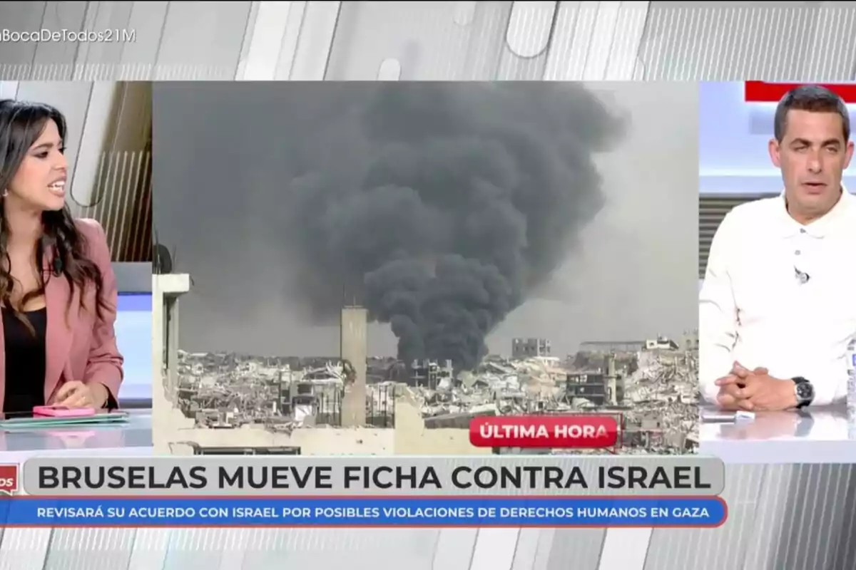Sarah Santaolalla y Antonio Naranjo discuten sobre una noticia de última hora que muestra una imagen de humo negro elevándose sobre una ciudad, con el titular Sarah Santaolalla y Antonio Naranjo discuten sobre una noticia de última hora que muestra una imagen de humo negro elevándose sobre una ciudad, con el titular