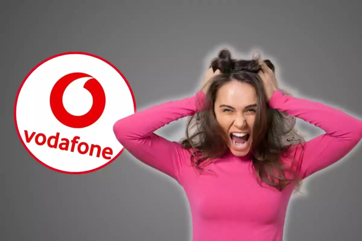 Mujer con expresión de frustración tirándose del cabello junto al logo de Vodafone.